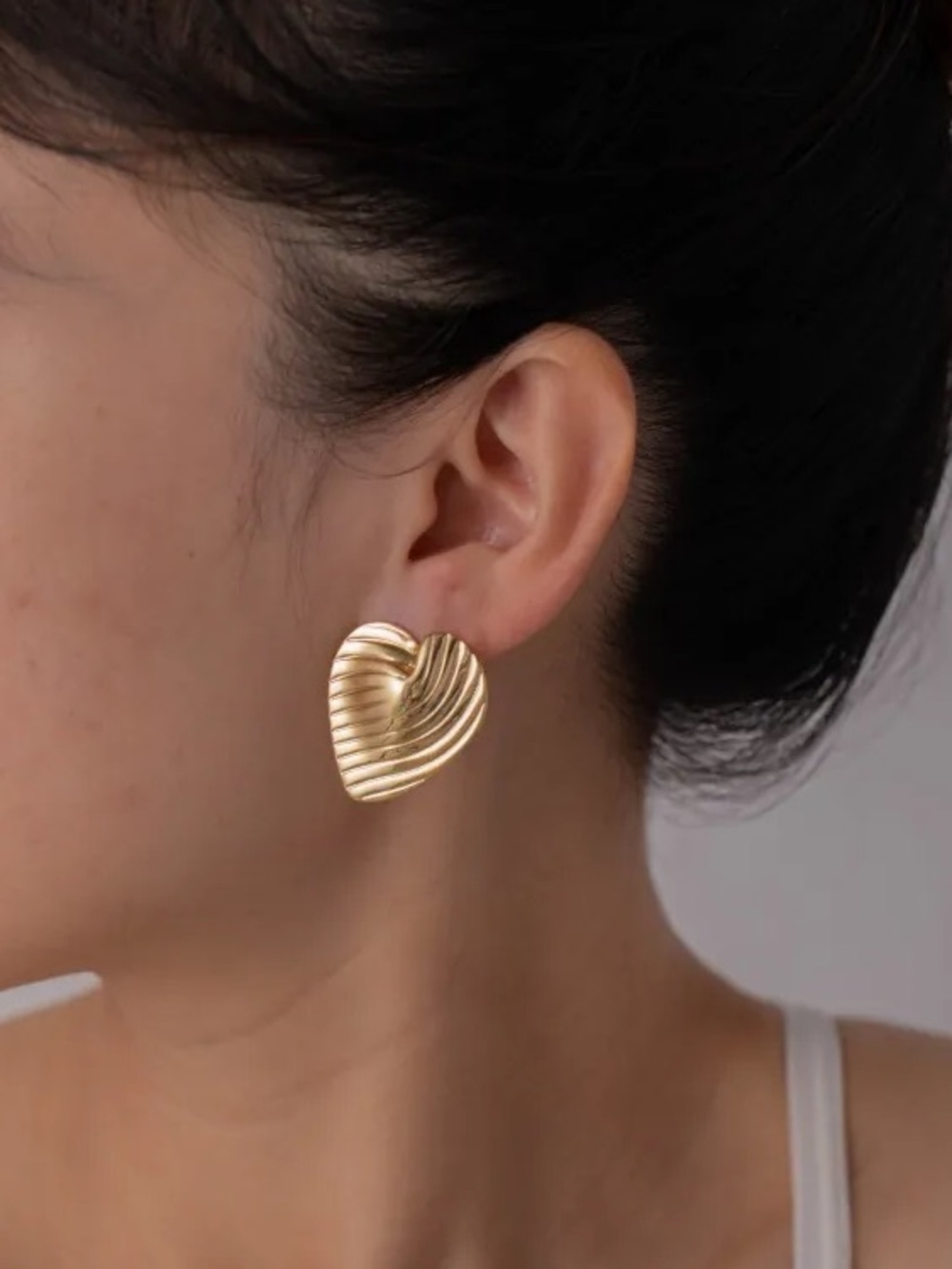Gold Heart Ribbed Stud Earrings.